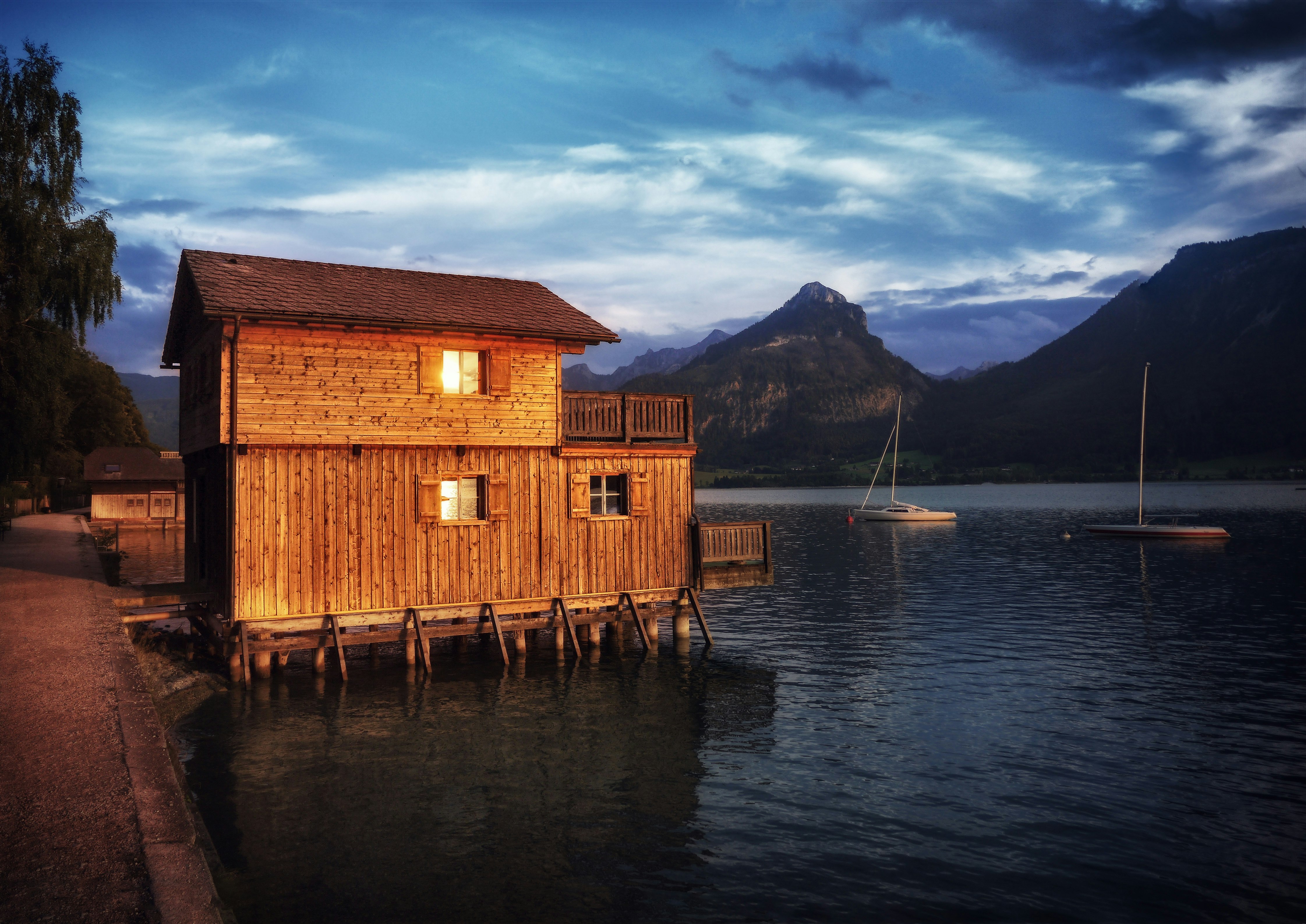 brown house near body of water